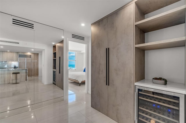 1500 Ocean Dr Unit 1003, Miami Beach, FL 33139 - interior space with light tile patterned flooring, visible vents, wine cooler, and recessed lighting