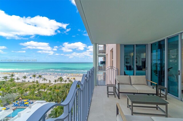 1500 Ocean Dr Unit 1003, Miami Beach, FL 33139 - balcony with outdoor lounge area, a view of the beach, and a water view