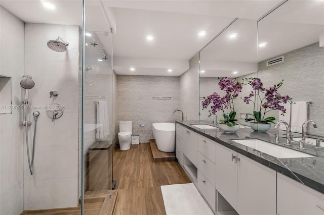 1500 Ocean Dr Unit 1003, Miami Beach, FL 33139 - full bathroom with tile walls, wood finished floors, a sink, and tiled shower