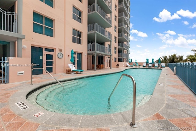 view of swimming pool featuring a patio