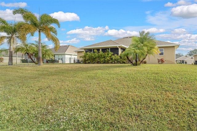 view of yard featuring a sunroom