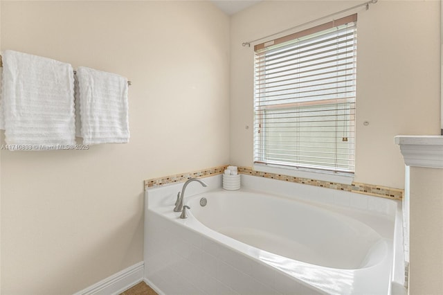 bathroom featuring a relaxing tiled tub