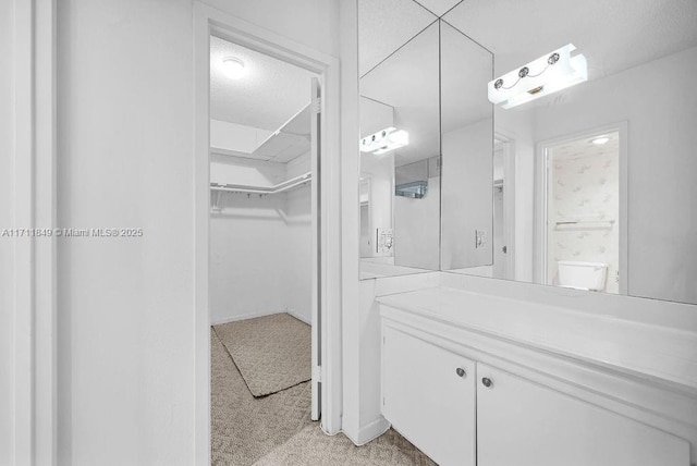 bathroom featuring vanity and a textured ceiling