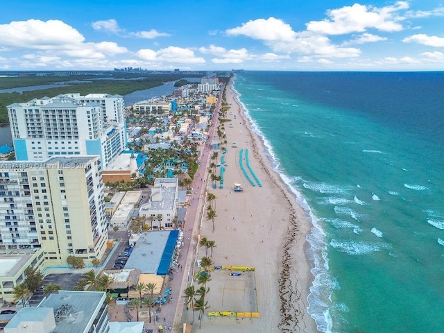 bird's eye view featuring a view of the beach and a water view