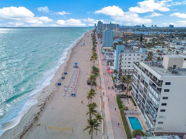 bird's eye view featuring a beach view and a water view