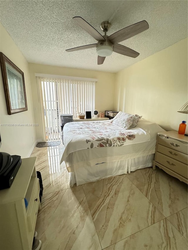 bedroom with a textured ceiling, access to outside, and ceiling fan