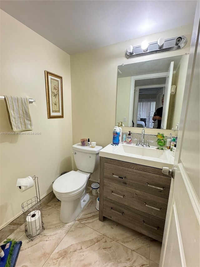 bathroom with vanity and toilet