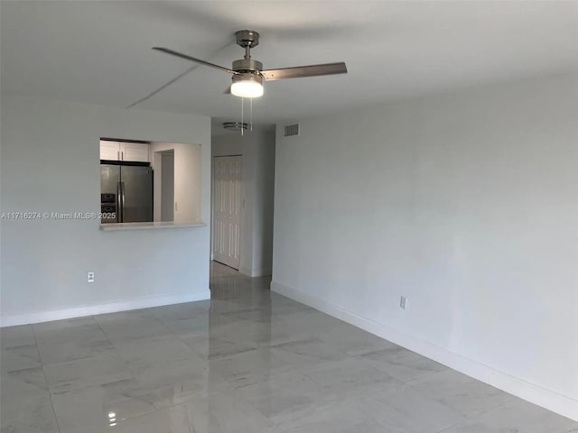 unfurnished room featuring ceiling fan