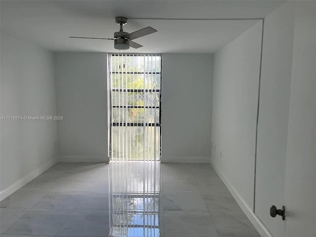 unfurnished room featuring ceiling fan