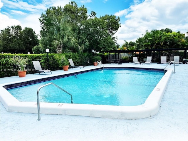 view of pool featuring a patio