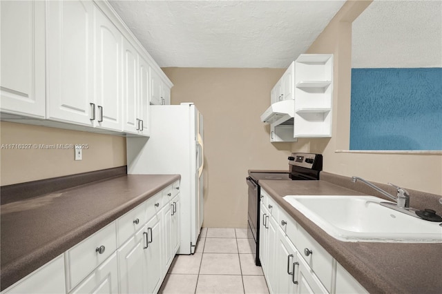 kitchen with white cabinetry, sink, light tile patterned floors, a textured ceiling, and stainless steel range with electric cooktop