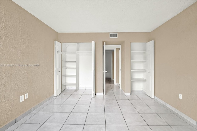 interior space with light tile patterned flooring