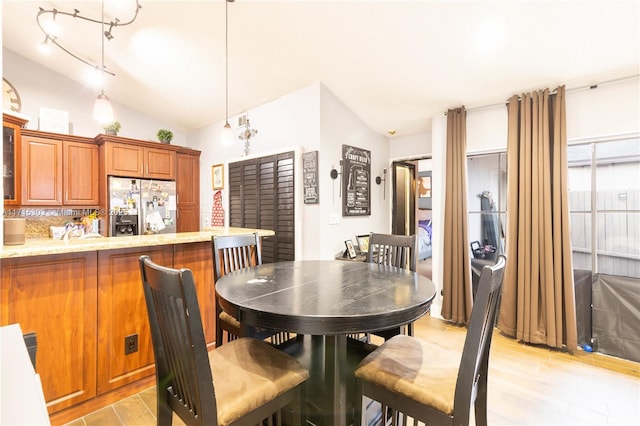 151 NW 115th Ave Unit 405, Plantation, FL 33325 - dining area with vaulted ceiling and light wood finished floors