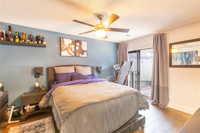 151 NW 115th Ave Unit 405, Plantation, FL 33325 - bedroom featuring wood finished floors, a textured ceiling, a ceiling fan, and access to exterior