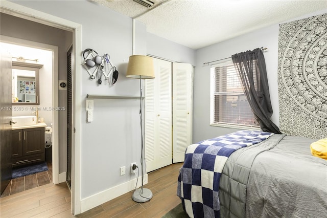 bedroom with a closet and a textured ceiling