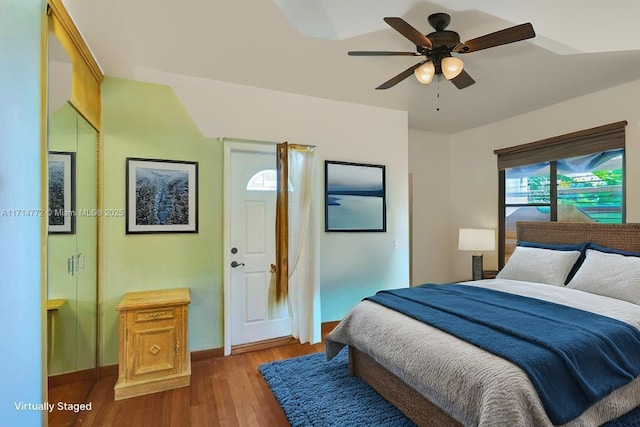 1445 Jackson St, Hollywood, FL 33020 - bedroom with light wood-style flooring, baseboards, and a ceiling fan