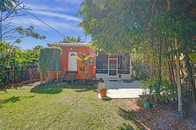 exterior space with entry steps, a patio area, and fence