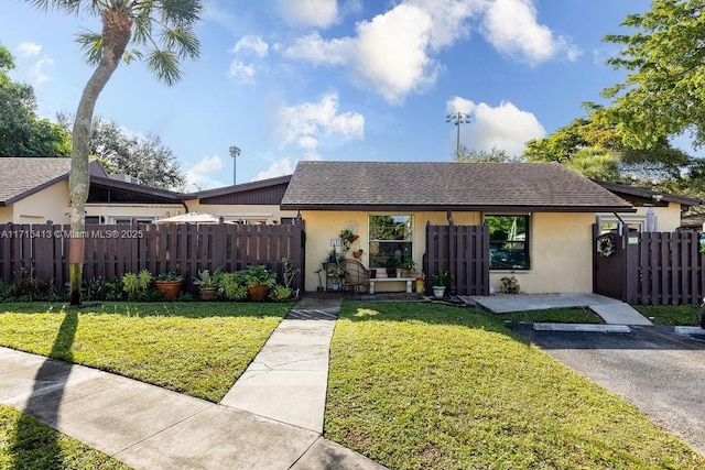 view of front of property with a front lawn