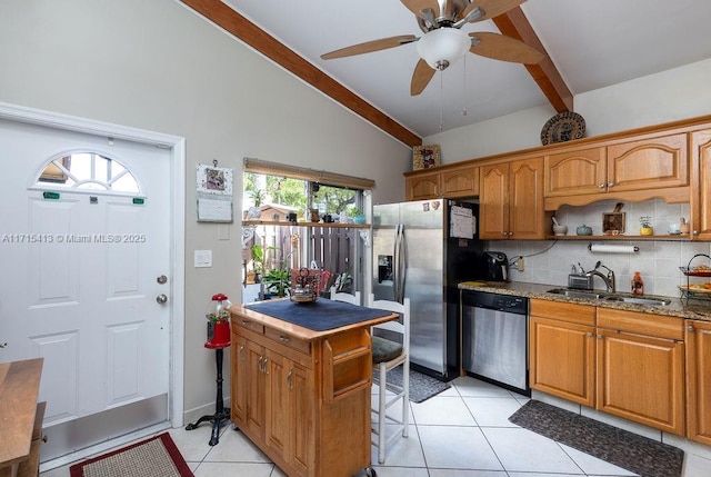 kitchen featuring sink, decorative backsplash, light tile patterned floors, appliances with stainless steel finishes, and light stone counters