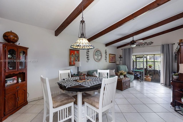 dining area featuring ceiling fan, light tile patterned flooring, and lofted ceiling with beams