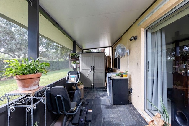 view of patio / terrace with a storage unit