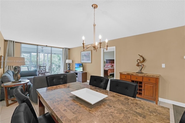 dining area with expansive windows, light tile patterned flooring, and a chandelier