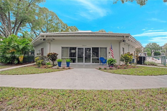 rear view of property with a yard