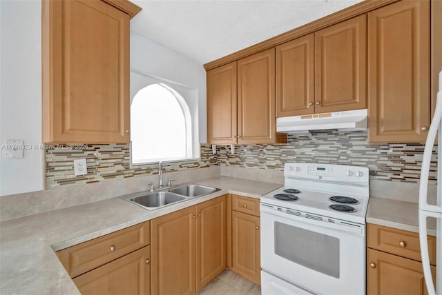 kitchen with white range with electric cooktop, decorative backsplash, and sink