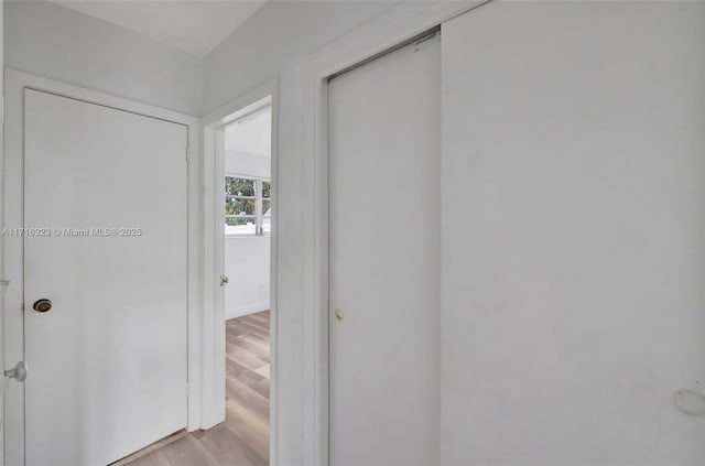 hallway with light wood-type flooring