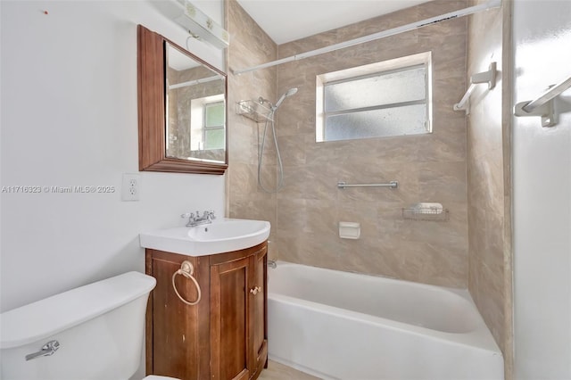 full bathroom with vanity, toilet, and tiled shower / bath