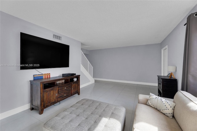 living room with a textured ceiling