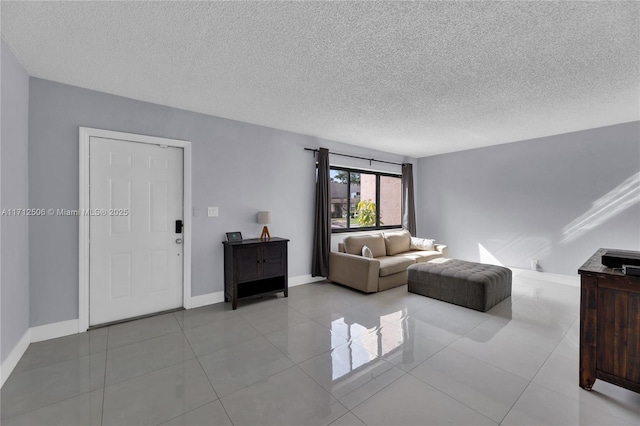 tiled living room with a textured ceiling