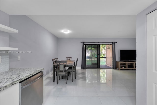 dining area featuring light tile patterned floors