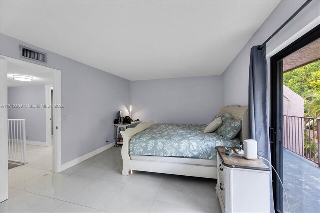 tiled bedroom featuring access to outside