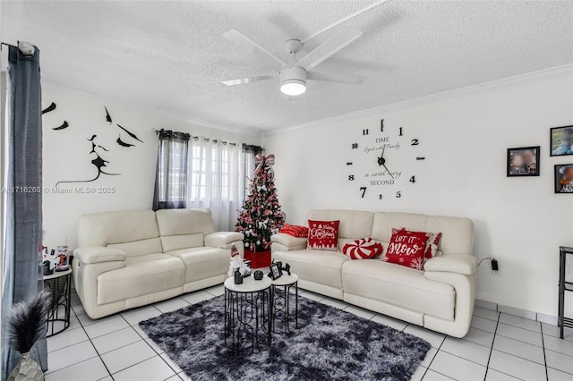 tiled living room with ceiling fan, a textured ceiling, and ornamental molding