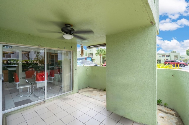 view of patio / terrace featuring a balcony and ceiling fan