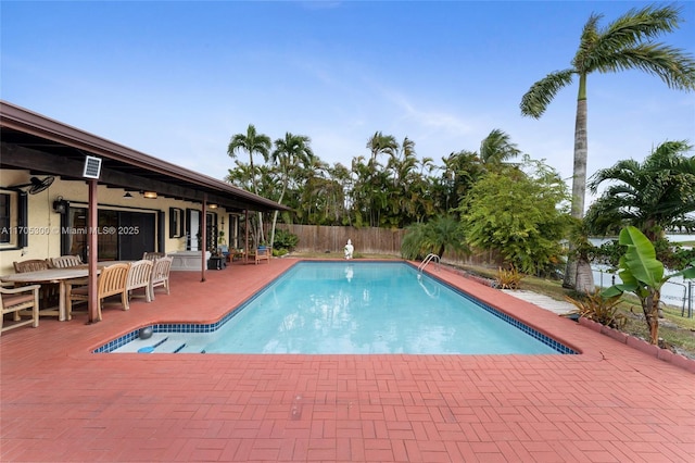 view of pool featuring a patio and ceiling fan