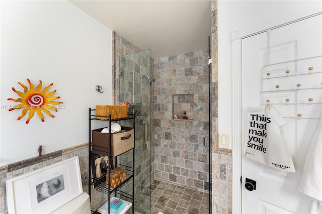 bathroom with a shower with shower door