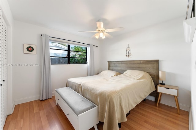 bedroom with hardwood / wood-style floors and ceiling fan