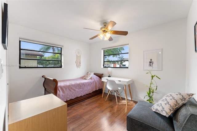 bedroom featuring ceiling fan and dark hardwood / wood-style flooring