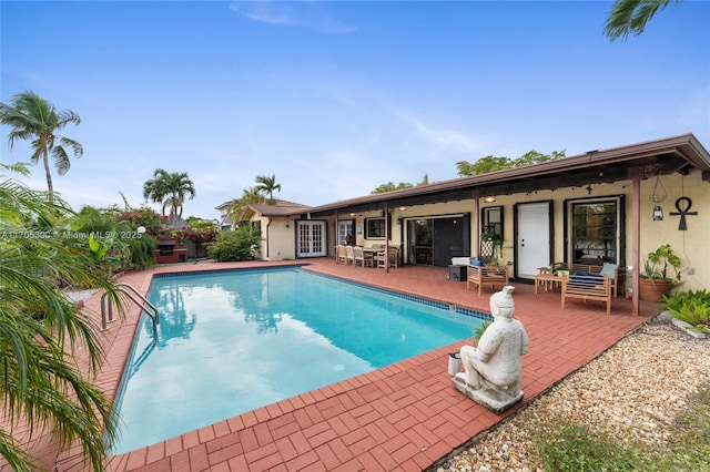 view of pool featuring a patio area