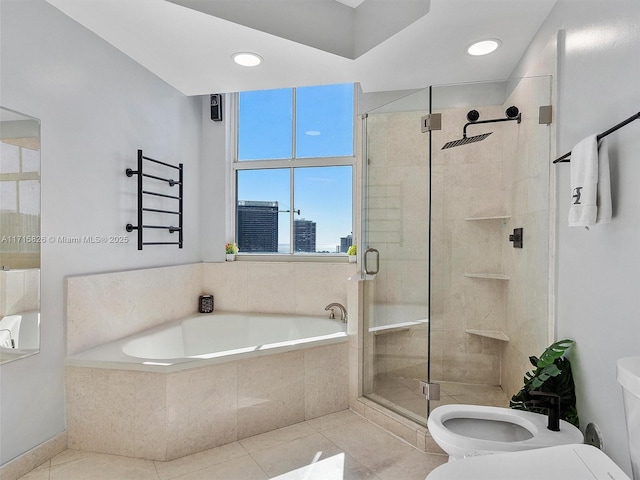 bathroom with tile patterned flooring, separate shower and tub, a bidet, and toilet