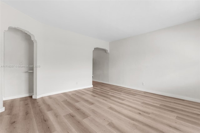 unfurnished room featuring light hardwood / wood-style floors