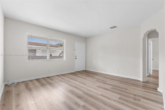 spare room with light hardwood / wood-style flooring