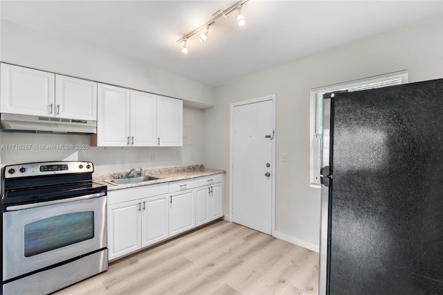 kitchen with sink, white cabinetry, stainless steel appliances, and light hardwood / wood-style flooring