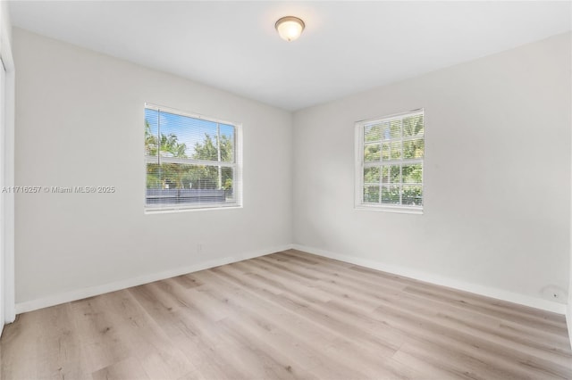 empty room with light hardwood / wood-style floors