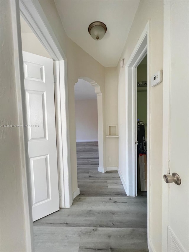 corridor featuring light hardwood / wood-style floors