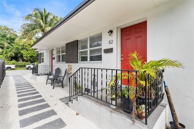 entrance to property featuring a porch