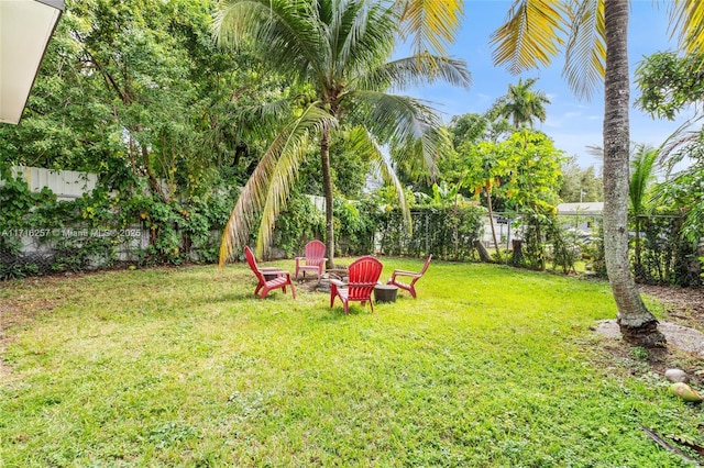 view of yard with an outdoor fire pit