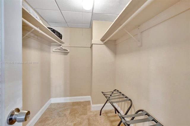 walk in closet featuring a paneled ceiling